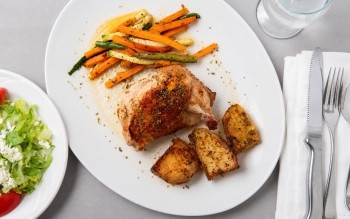 Boneless half chicken, drummette on, stuffed with feta cheese and topped with Greek spices