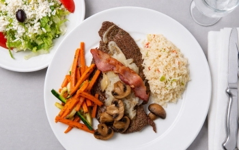 Tender baby beef liver, topped with caramelized onion, fried to perfection