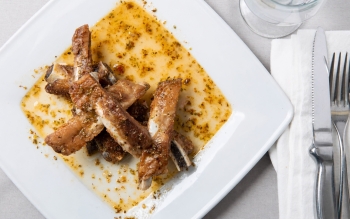 Tender baby back ribs prepared with garlic, lemon and oregano